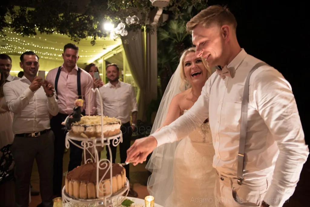 Cutting the cake at sunset at Villa Antiche Mura