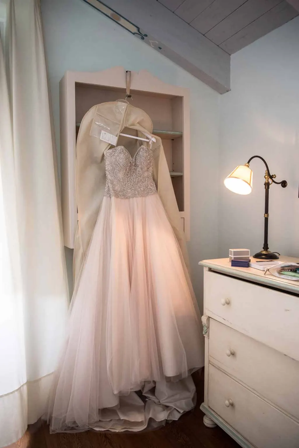 Wedding dress hanging in the bride’s room