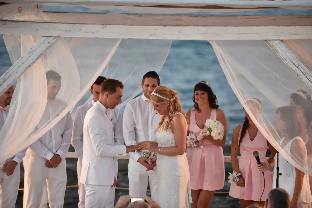 Exchange of rings at a beach wedding in Puglia
