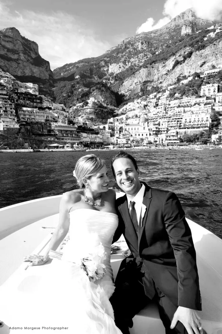 Happy bride and groom with Positano in the background