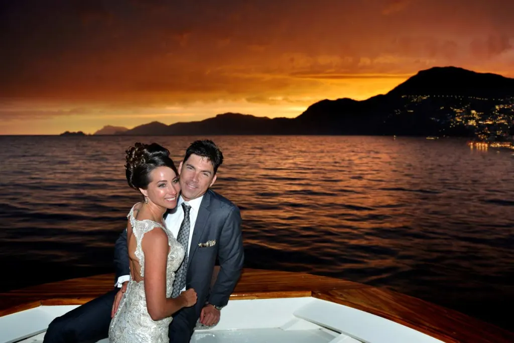Bride and groom at sunset above Positano