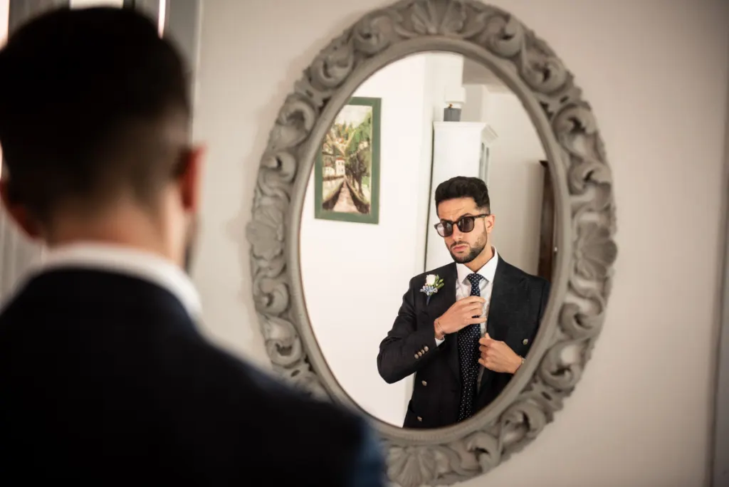 Groom getting ready before his wedding ceremony in Puglia