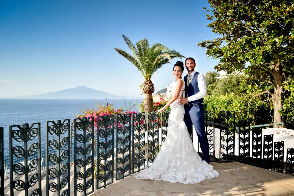 Bride and groom posing in the grounds of Villa Antiche Mura